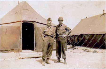 Korean War Soldiers take a photo together in front of camp