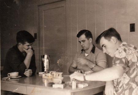 Sailors having breakfast together in the barracks during the Korean War conflict