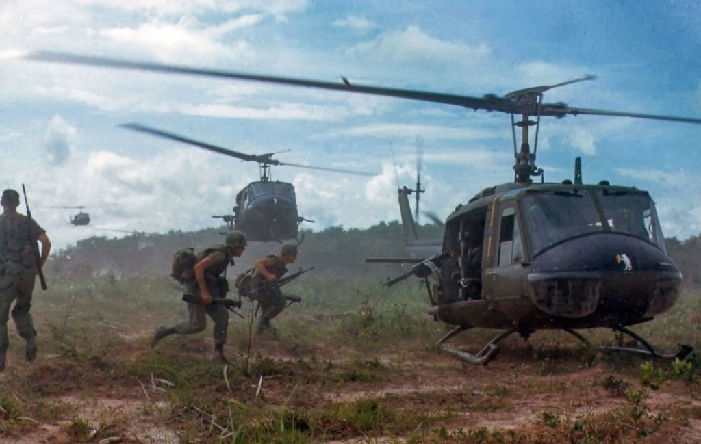 Vietnam War Soldiers Run Towards a UH-1 Huey
